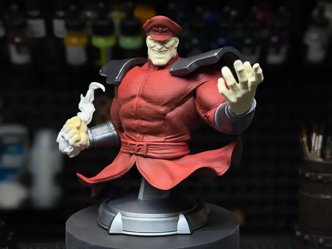 M. Bison bust with the red suit blocked in