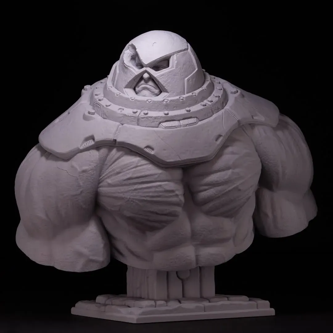Primed grey Juggernaut bust, even front light showing the full sculpt and base